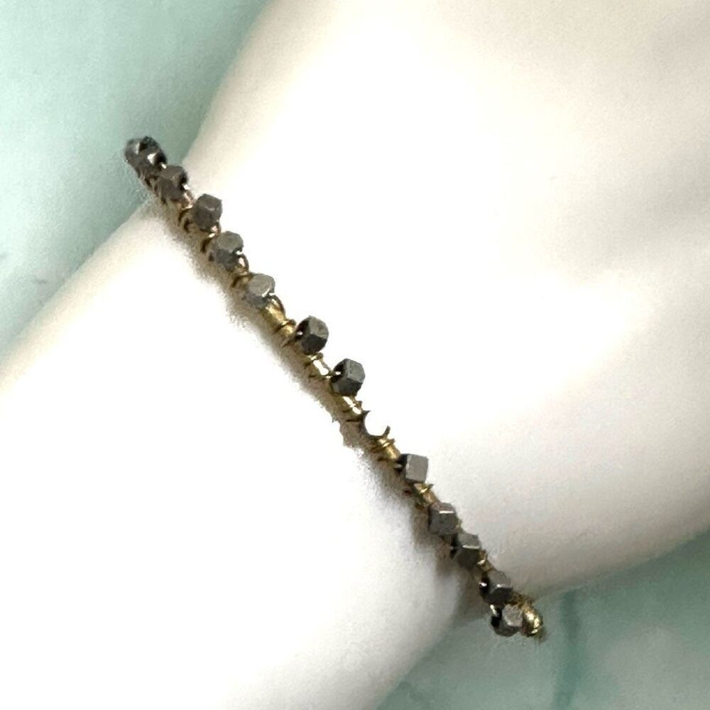 Canvas silver and gold tone bangle bracelet